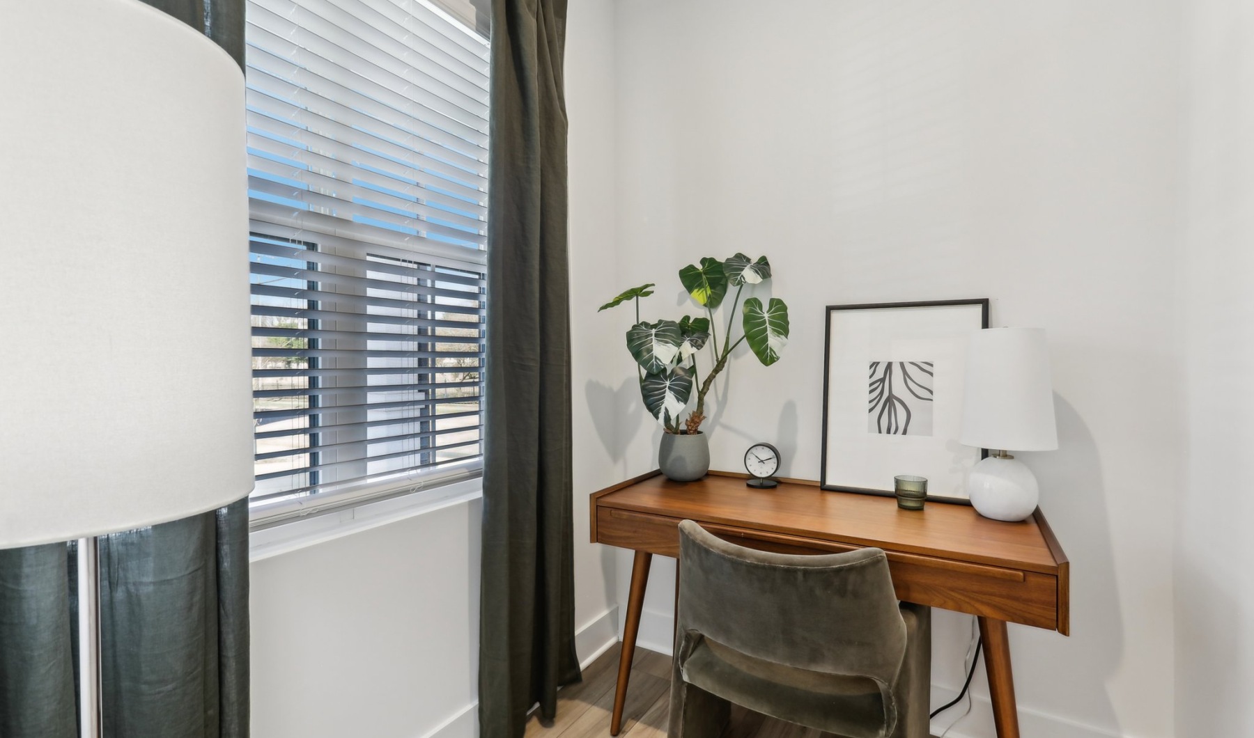 Home office with wood desk and window overlooking the community Home office with wood desk and window overlooking the community