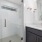 bathroom with a large mirror and ample lighting