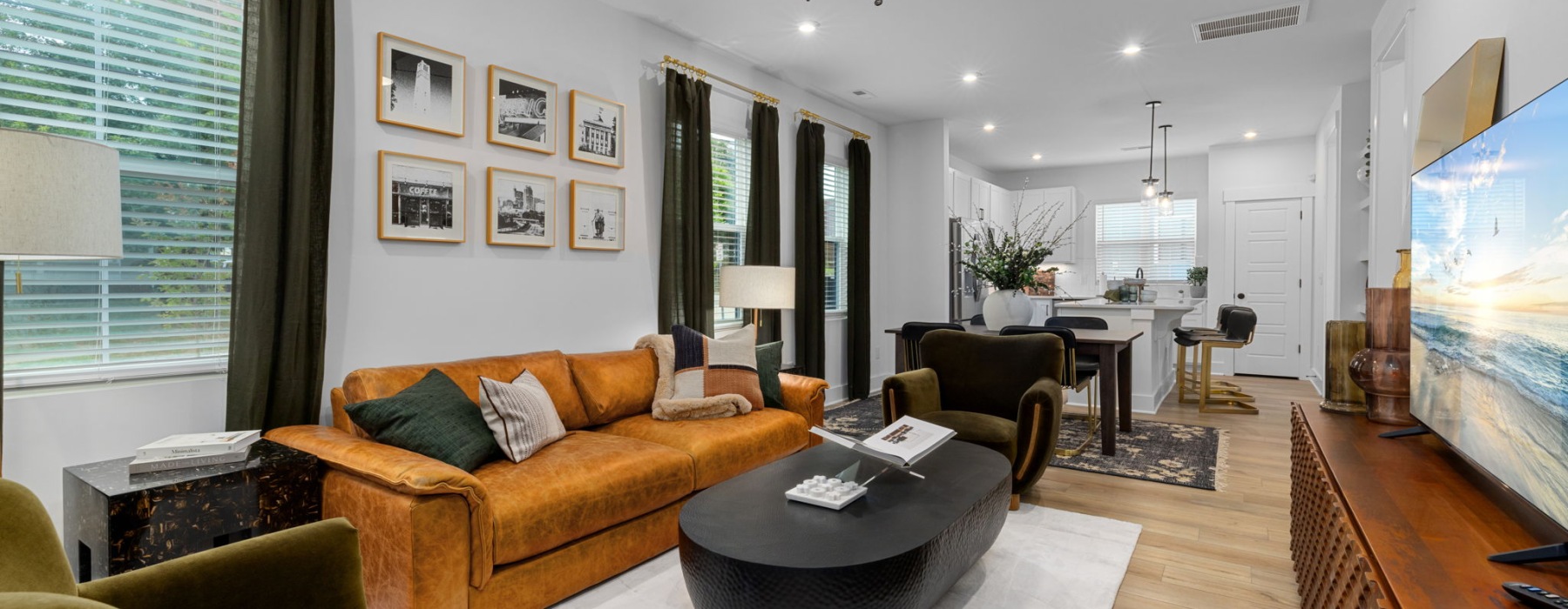 a living room with a couch and a fan