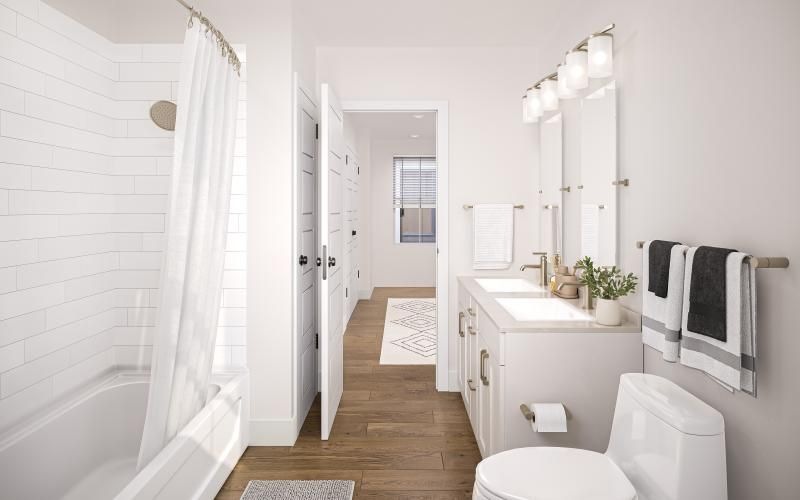 a bathroom with a tub toilet and sink